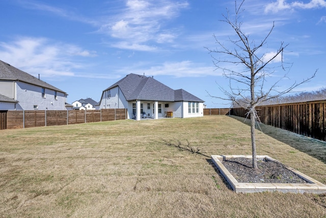 view of yard featuring a fenced backyard