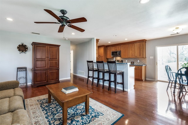 751 E Cooper St, Van Alstyne, TX 75495 - living room featuring a ceiling fan, recessed lighting, baseboards, and wood finished floors
