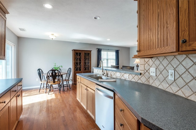 751 E Cooper St, Van Alstyne, TX 75495 - kitchen featuring dishwasher, a sink, dark countertops, wood finished floors, and recessed lighting
