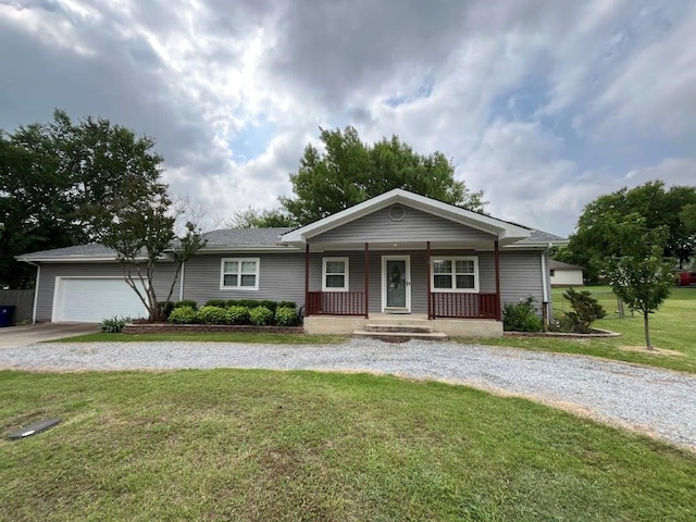 751 E Cooper St, Van Alstyne, TX 75495 - ranch-style home featuring curved driveway, covered porch, a front lawn, and a garage