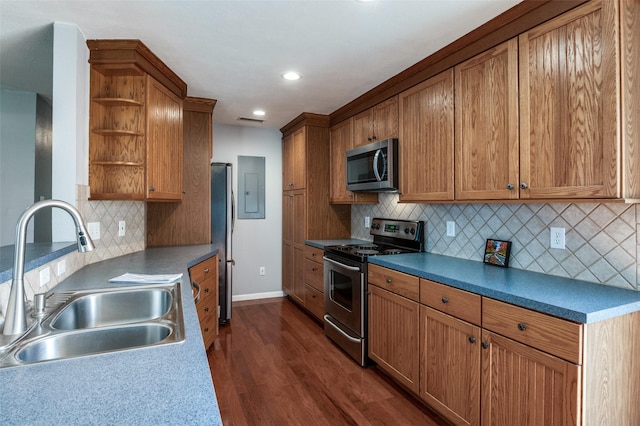751 E Cooper St, Van Alstyne, TX 75495 - kitchen with appliances with stainless steel finishes, a sink, open shelves, dark wood-type flooring, and recessed lighting