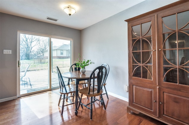 751 E Cooper St, Van Alstyne, TX 75495 - dining space featuring baseboards and dark wood-type flooring