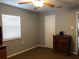 751 E Cooper St, Van Alstyne, TX 75495 - unfurnished bedroom with baseboards and a ceiling fan