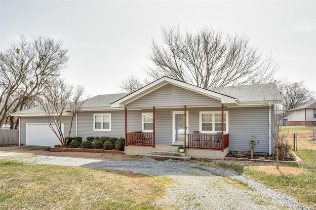 ranch-style home featuring a shingled roof, fence, a porch, concrete driveway, and an attached garage