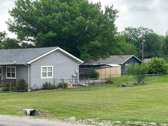 751 E Cooper St, Van Alstyne, TX 75495 - view of side of property featuring roof with shingles