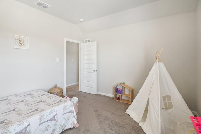 bedroom featuring visible vents, carpet flooring, baseboards, and vaulted ceiling