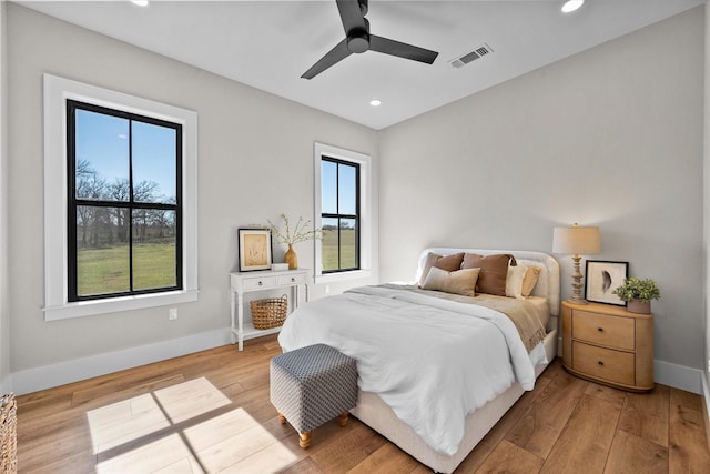 bedroom with recessed lighting, visible vents, baseboards, and hardwood / wood-style floors