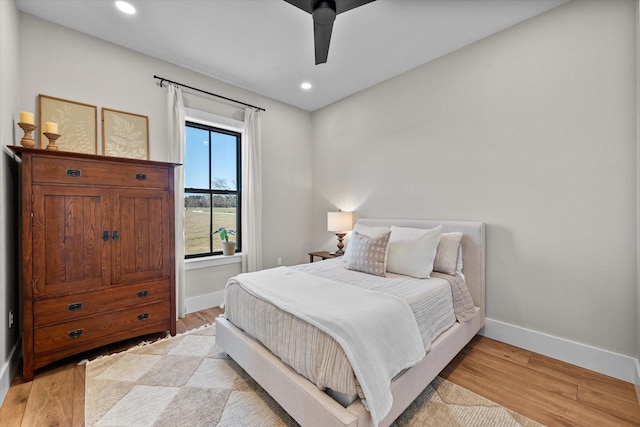 bedroom featuring recessed lighting, light wood-style flooring, and baseboards