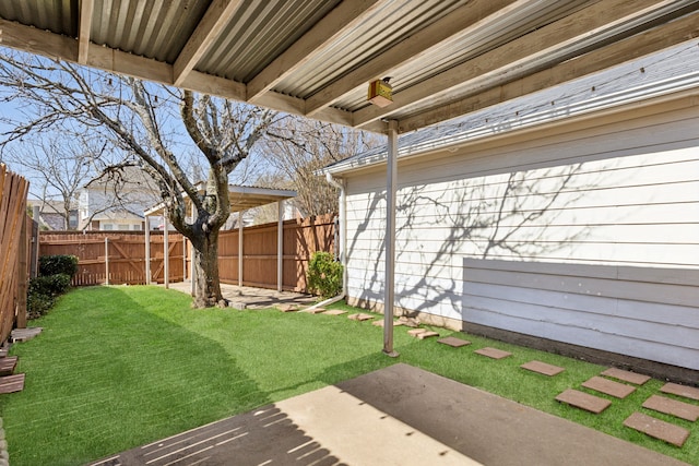 view of yard with a patio area and a fenced backyard