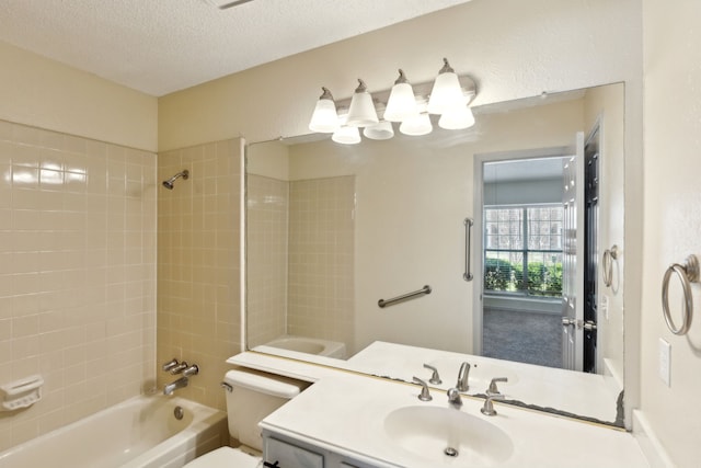 full bathroom with a textured ceiling, shower / washtub combination, vanity, and toilet