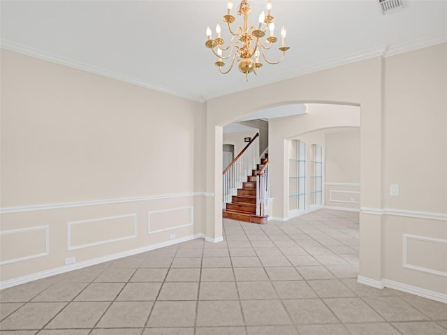 empty room featuring arched walkways, a notable chandelier, stairway, and ornamental molding