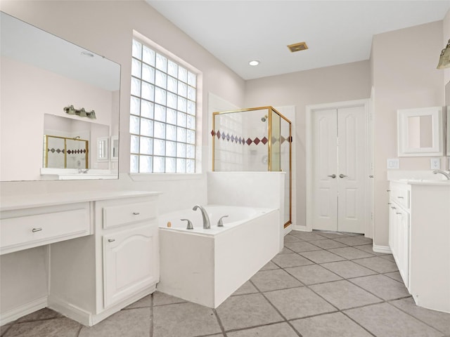 full bath featuring tile patterned flooring, visible vents, a shower stall, a garden tub, and vanity