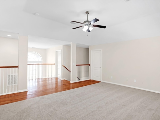 unfurnished room with baseboards, ceiling fan, and carpet flooring