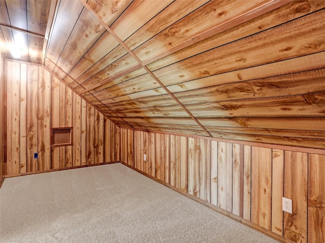 additional living space featuring carpet flooring, wood walls, wood ceiling, and lofted ceiling