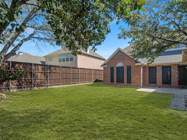 view of yard with a fenced backyard