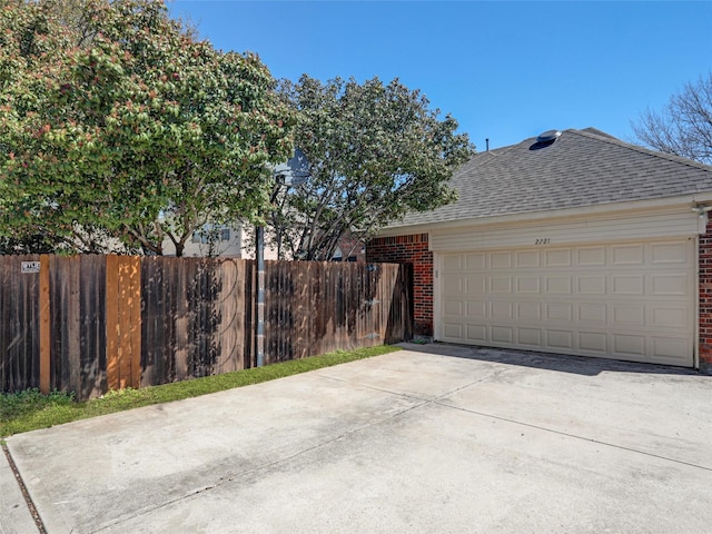 garage with fence