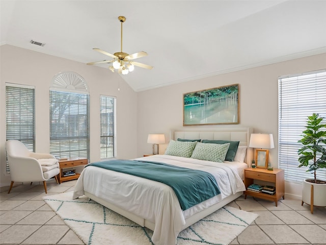 bedroom with light tile patterned floors, visible vents, and lofted ceiling