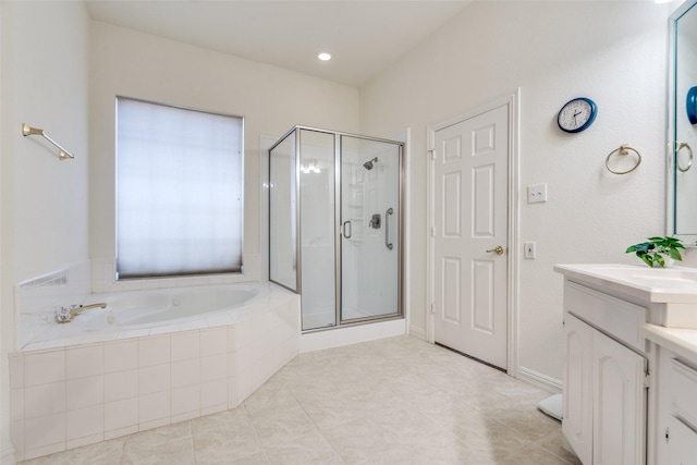 bathroom with a shower stall, a bath, vanity, and tile patterned flooring