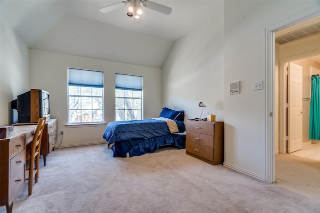 carpeted bedroom with visible vents, baseboards, ceiling fan, and vaulted ceiling