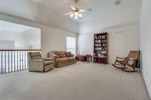 sitting room featuring visible vents, lofted ceiling, carpet, and ceiling fan