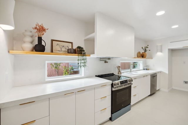 kitchen featuring open shelves, modern cabinets, and appliances with stainless steel finishes