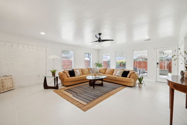 living room featuring visible vents, brick wall, recessed lighting, ceiling fan, and tile patterned floors