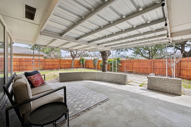 view of patio featuring an outdoor hangout area and a fenced backyard