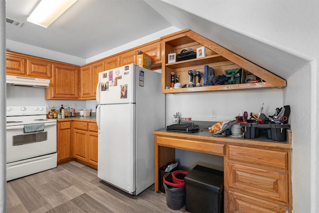 kitchen featuring under cabinet range hood, white appliances, light countertops, and light wood-style floors