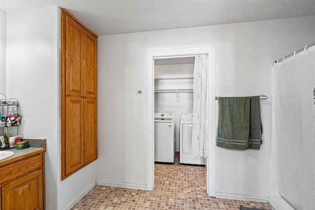 bathroom with vanity, a shower with shower curtain, and washing machine and clothes dryer