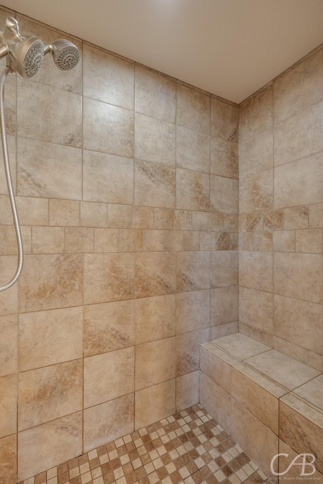 full bathroom with tiled shower