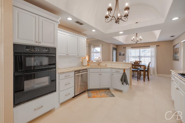 kitchen with a sink, dobule oven black, stainless steel dishwasher, a raised ceiling, and a chandelier