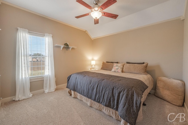 bedroom featuring crown molding, baseboards, carpet, lofted ceiling, and a ceiling fan