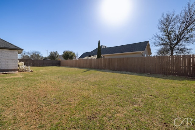 view of yard featuring fence private yard