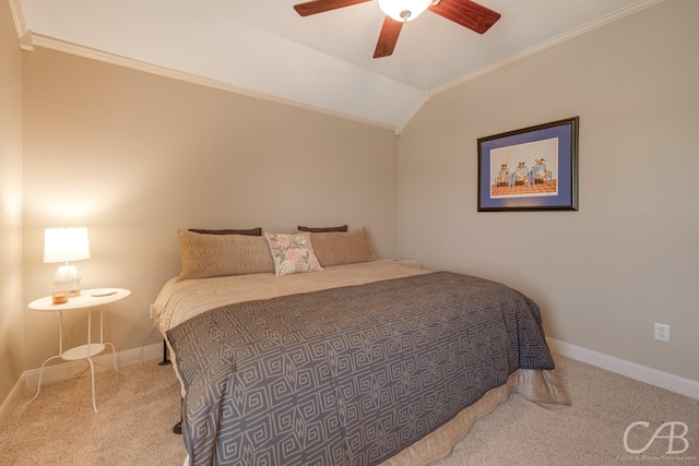 carpeted bedroom with baseboards, lofted ceiling, a ceiling fan, and crown molding