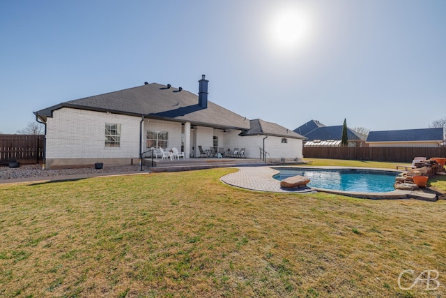 view of pool with a patio area, a yard, a fenced backyard, and a fenced in pool