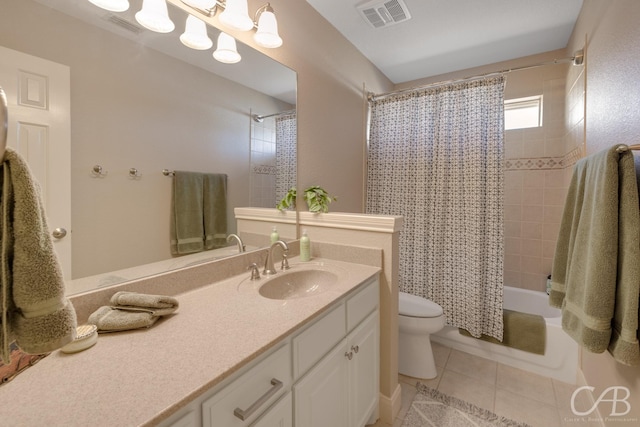 bathroom with tile patterned floors, visible vents, toilet, and vanity