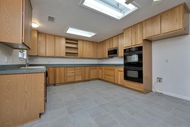 kitchen featuring stainless steel microwave, visible vents, open shelves, dobule oven black, and a sink