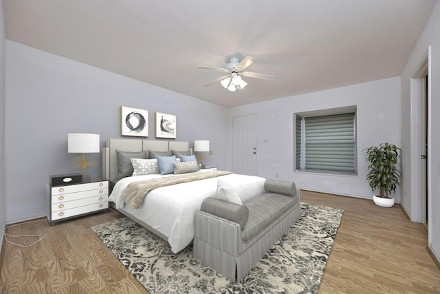 bedroom with light wood-style floors and ceiling fan