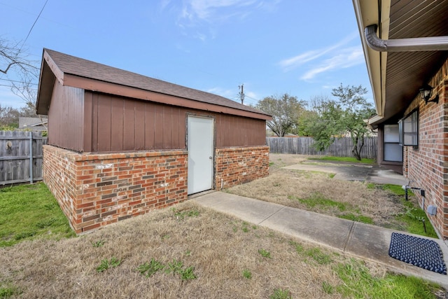 exterior space with an outbuilding and a fenced backyard