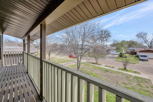 balcony featuring covered porch and a residential view