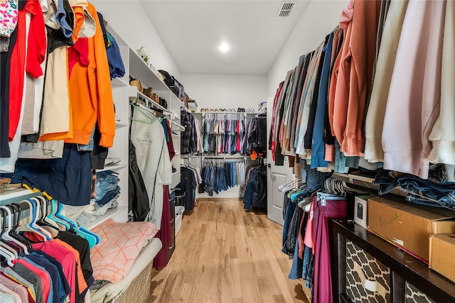 spacious closet with visible vents and wood finished floors