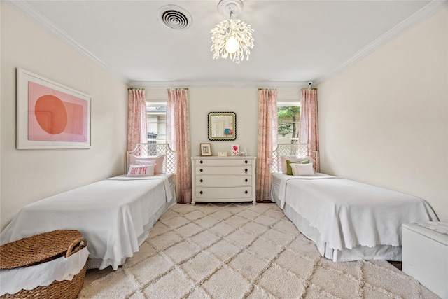 bedroom with visible vents, light carpet, ornamental molding, and a chandelier