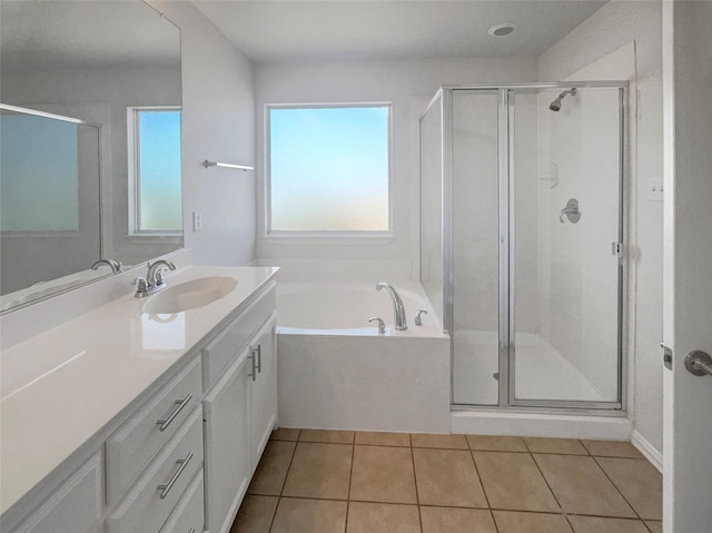 bathroom with a shower stall, vanity, and tile patterned flooring