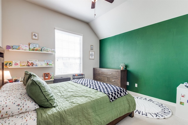 carpeted bedroom featuring vaulted ceiling, a ceiling fan, and baseboards