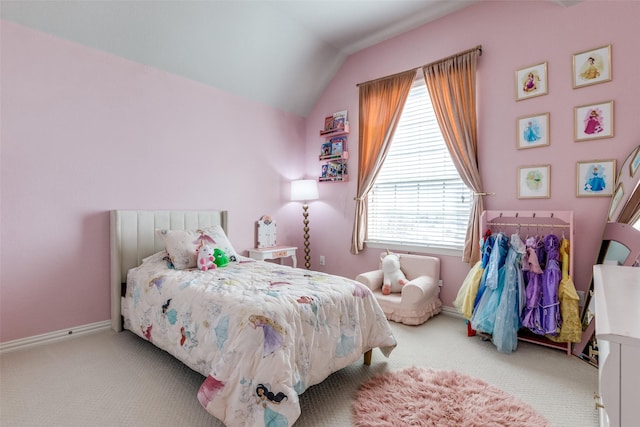 bedroom with baseboards, carpet, and vaulted ceiling