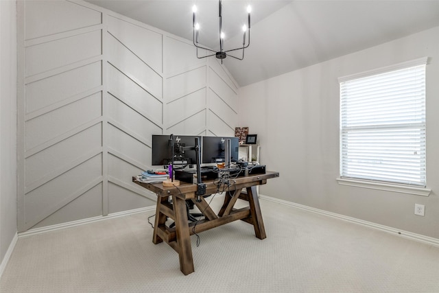 office area featuring lofted ceiling, carpet flooring, baseboards, and a chandelier