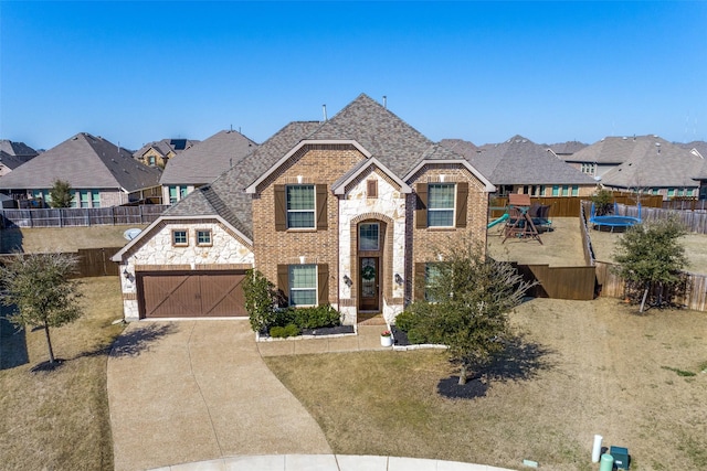 view of front facade with stone siding, a playground, concrete driveway, an attached garage, and brick siding