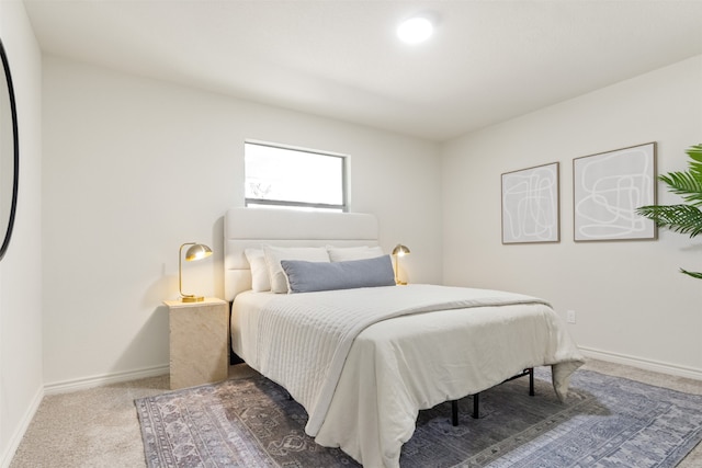 carpeted bedroom with baseboards