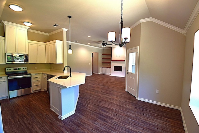 110 Saint Francis Ln, Mabank, TX 75156 - kitchen featuring appliances with stainless steel finishes, a sink, open floor plan, a peninsula, and light countertops