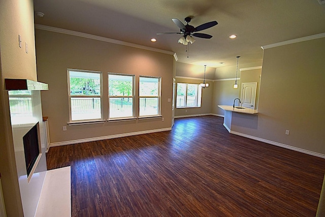 110 Saint Francis Ln, Mabank, TX 75156 - unfurnished living room featuring a fireplace, ceiling fan, baseboards, dark wood-style flooring, and ornamental molding